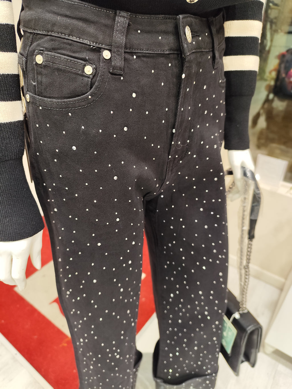 Jeans con risvolto e brillantini